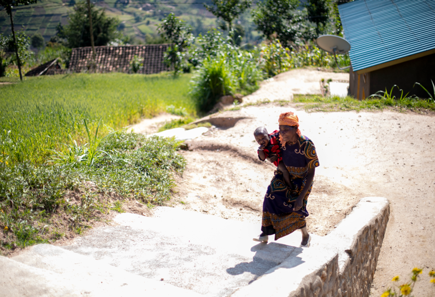 A mother and child in one of the Green Villages supported by UNDP