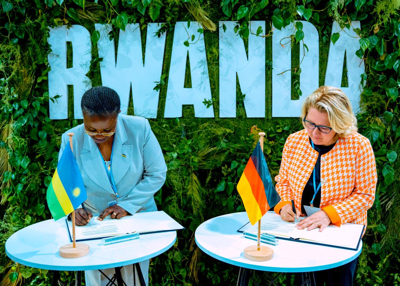 Rwanda’s Minister of Environment signing an NDC facility partnership with Germany’s Federal Minister of Economic Cooperation and Development at COP 27 in Sharm el-Sheikh, Egypt
