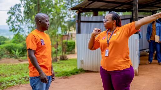 IOM’s National PSEA Officer, Sophie, discusses changes at Nyabiheke camp following the trainings with Emmanuel from MINEMA